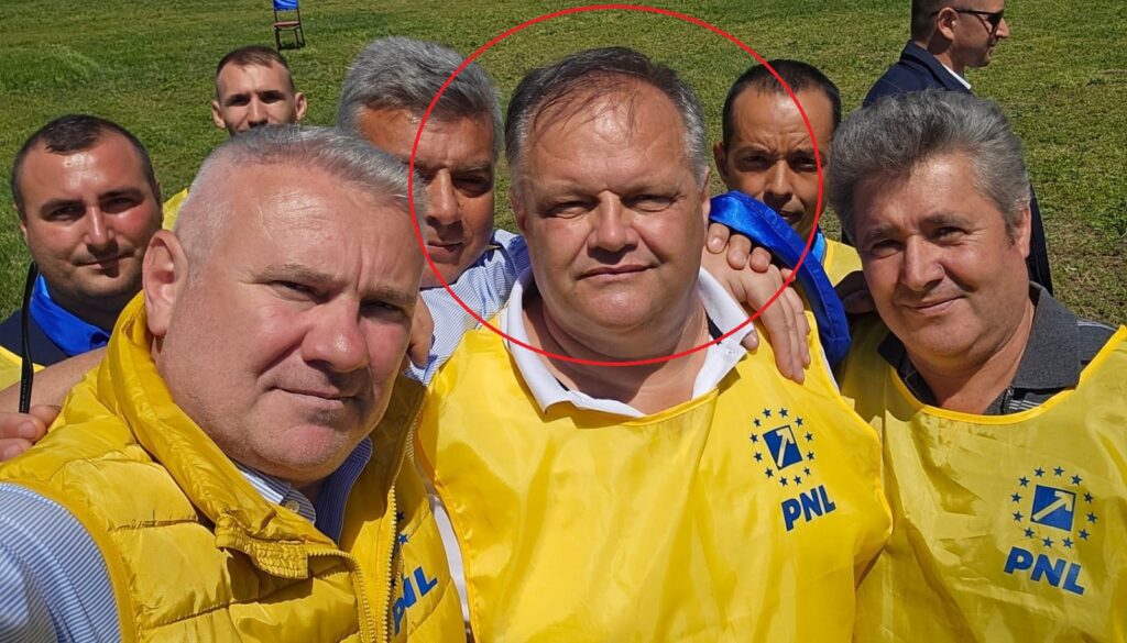 Group of men in yellow PNL jackets posing for a selfie outdoors, with the central man circled for emphasis.