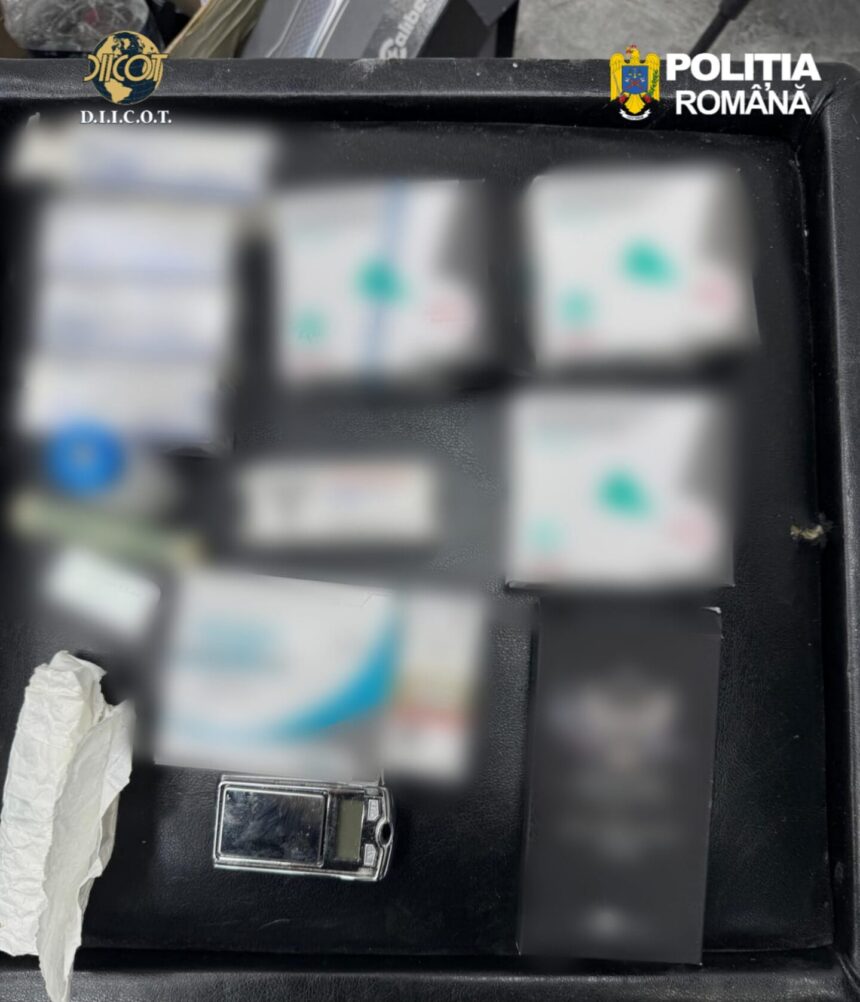 Open black case with several blurred boxes and a small lighter; logos for D.I.C.O.T. and Politia Română visible at top corners, suggesting seized evidence.