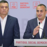 Two men in suits stand at a podium with a microphone, in front of a backdrop and banner reading 'PARTIDUL SOCIAL DEMOCRAT' with PSD logos.