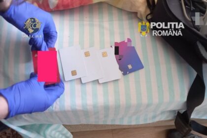 Two gloved hands arrange several white and purple smart cards with gold chips on a striped surface, with DIICOT and Romanian police logos visible.