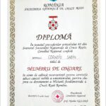 Romanian diploma certificate with ornate decorative border, red cross seal, and the word 'DIPLOMĂ' in the center, awarded in Bucharest on July 4, 2001, recognizing honorary membership in the National Society of the Red Cross of Romania.