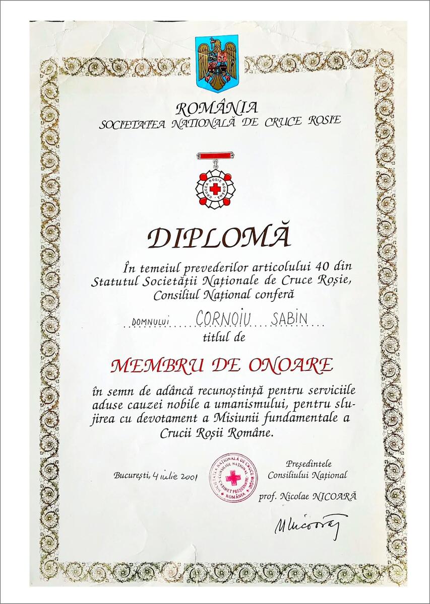 Romanian diploma certificate with ornate decorative border, red cross seal, and the word 'DIPLOMĂ' in the center, awarded in Bucharest on July 4, 2001, recognizing honorary membership in the National Society of the Red Cross of Romania.