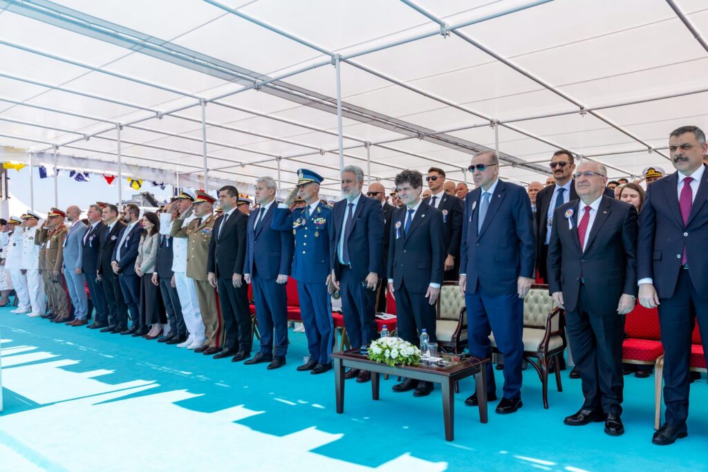 - Jurnalul Olteniei – Știri din Craiova și Oltenia Row of uniformed and civilian officials standing at a formal ceremony under a white canopy on a blue carpet.