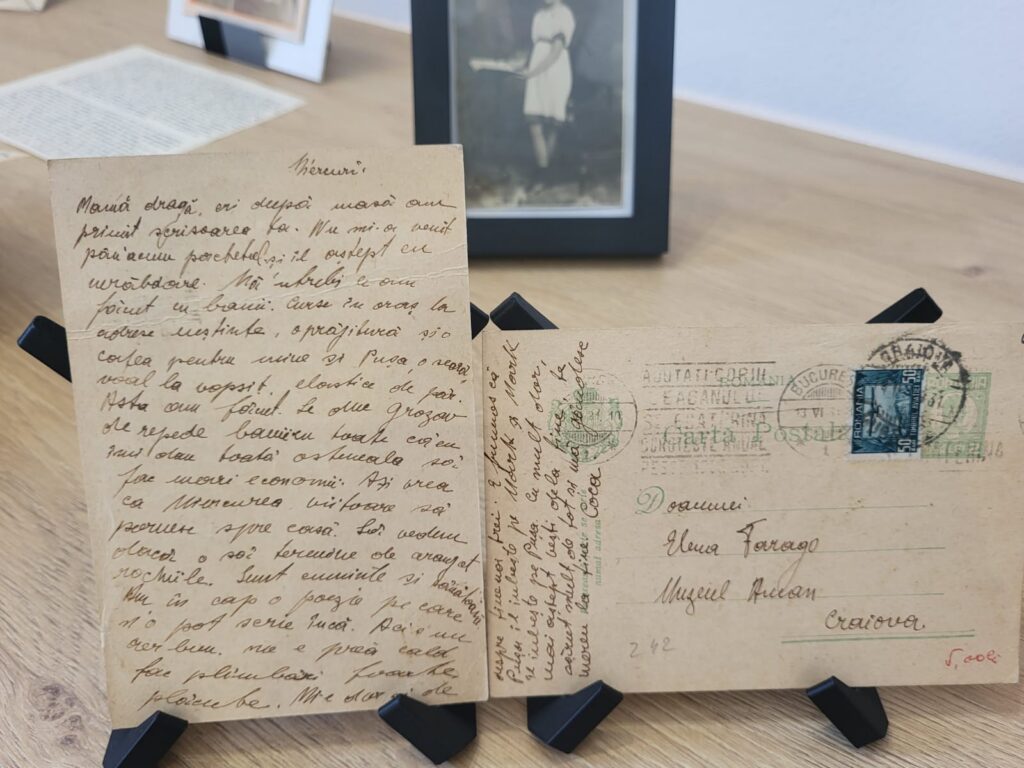 Casa Memorială Elena Farago a fost reabilitată de Consiliul Județean Dolj și reintră în circuitul de vizitat Finanțarea pentru - Jurnalul Olteniei – Știri din Craiova și Oltenia Old handwritten letter and vintage postcard with stamps on a wooden table; a framed photo is blurred in the background.