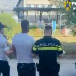 Three men walking away from the camera, one in a police uniform labeled POLITIA, near a white van at an outdoor area.