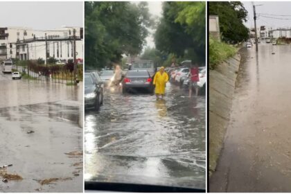 City street heavily flooded after rain, with cars and debris in water along the curb.