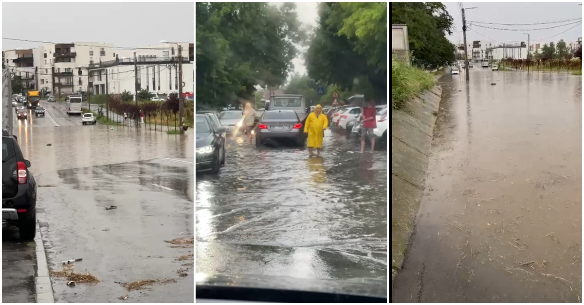 City street heavily flooded after rain, with cars and debris in water along the curb.