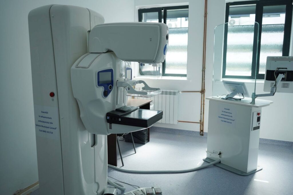 spitalul caracal 2 - Jurnalul Olteniei – Știri din Craiova și Oltenia Hospital CT scanner with patient table in a bright radiology room, ready for imaging session.