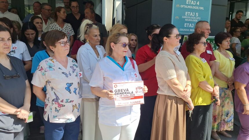 A diverse crowd of healthcare workers and civilians standing outdoors near a hospital entrance, some wearing scrubs and badges.