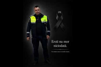 Policeman in a dark uniform with a neon vest beside a black ribbon on a dark background; memorial text in Romanian.