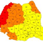 Map of Romania showing counties shaded in red, orange, and yellow.