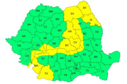 Color-coded map of a country’s districts with two-letter codes, mostly green and some yellow.