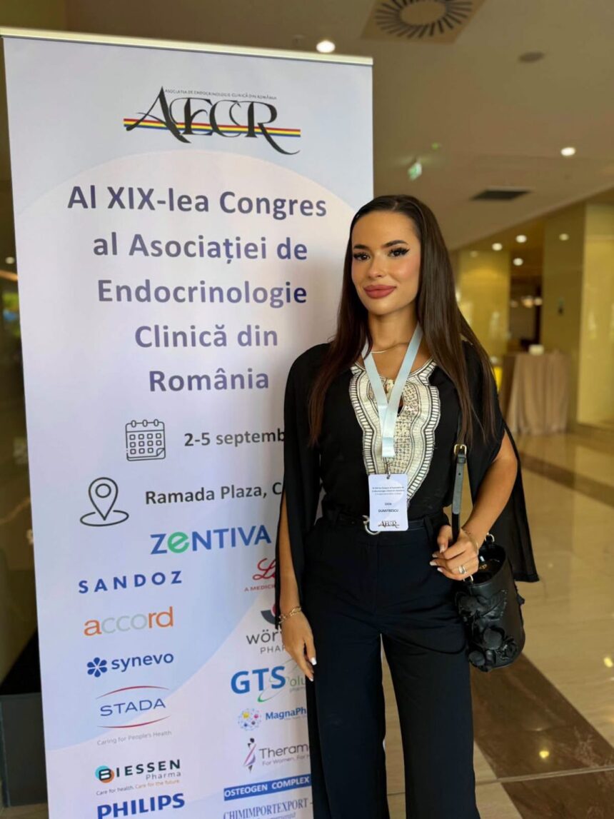 Woman standing next to a conference banner for AI XIX-lea Congres al Asociatiei de Endocrinologie Clinica din Romania, wearing a lanyard badge.