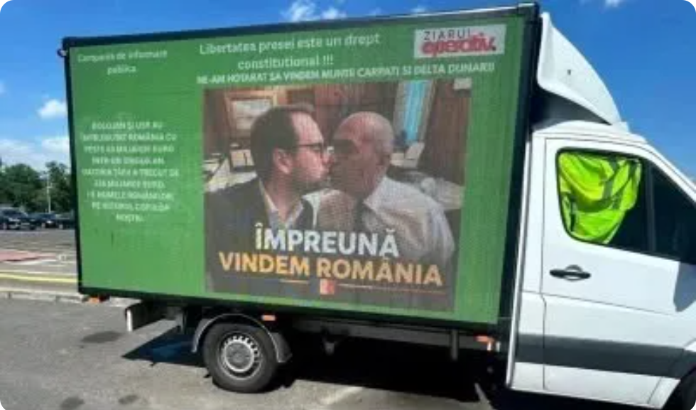 Green political banner on a white truck showing two men talking with the slogan 'Împreună vindem România'