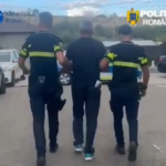 Three people walk down a street: two uniformed officers escorting a man in the middle, logos for Ministerul Public and Politia Romana visible.