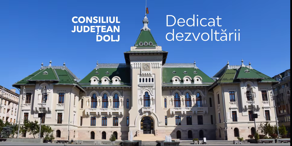 Front view of a grand civic building with a green roof and steps, under a blue sky; white Romanian text on the facade reads “CONSILIUL JUDETEAN DOLJ” and “Dedicat dezvoltării.”