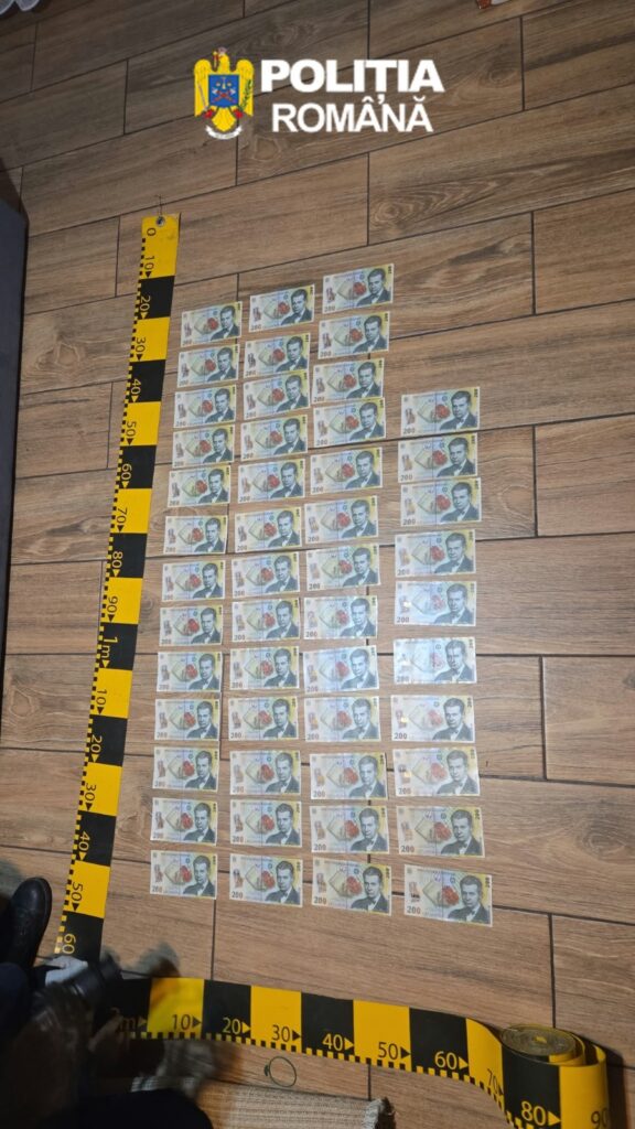 Logo of Politia Romana at top; rows of 200 lei notes spread on a wooden floor with a yellow measuring tape nearby, suggesting seized cash.