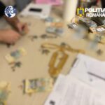 Blurred table with cash stacks and documents; DIICOT and Poliția Română logos in the corners.