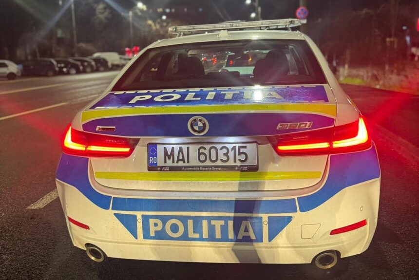 Rear view of a Romanian police car at night with red taillights, blue-yellow livery, and 'POLITIA' markings; license MAI 60315.