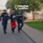 Two Romanian police officers escort a person down a sidewalk on a blurred street, with the 'Poliția Română' logo visible at the top.